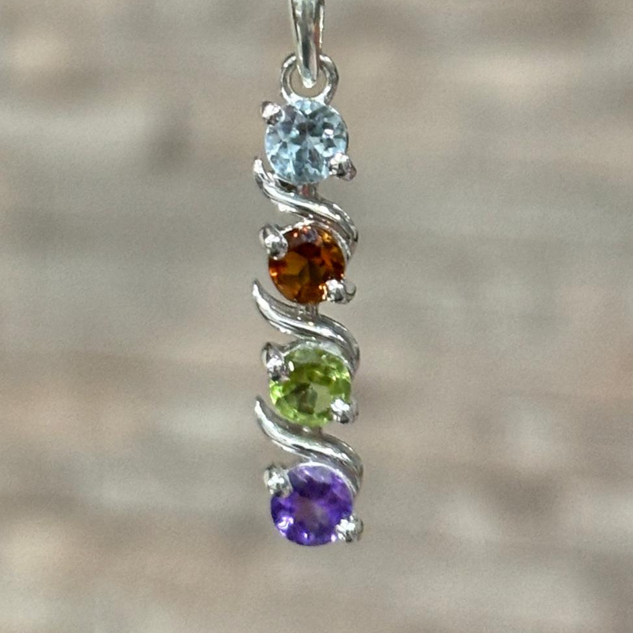 Elegant 925 sterling silver pendant with amethyst, peridot, citrine and blue topaz gemstones in spiral design for women