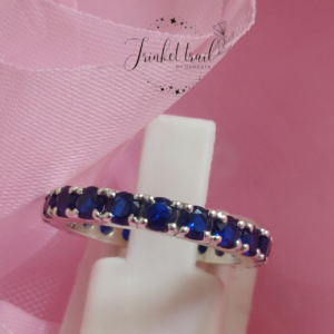 Elegant silver eternity band ring with royal blue sapphire-look stones for women