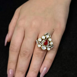 Elegant gold plated red stone statement ring with kundan style crystal detailing for women fashion jewellery by Trinket Trails