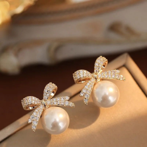 Elegant rose gold pearl bow stud earrings with sparkling crystal detailing for women
