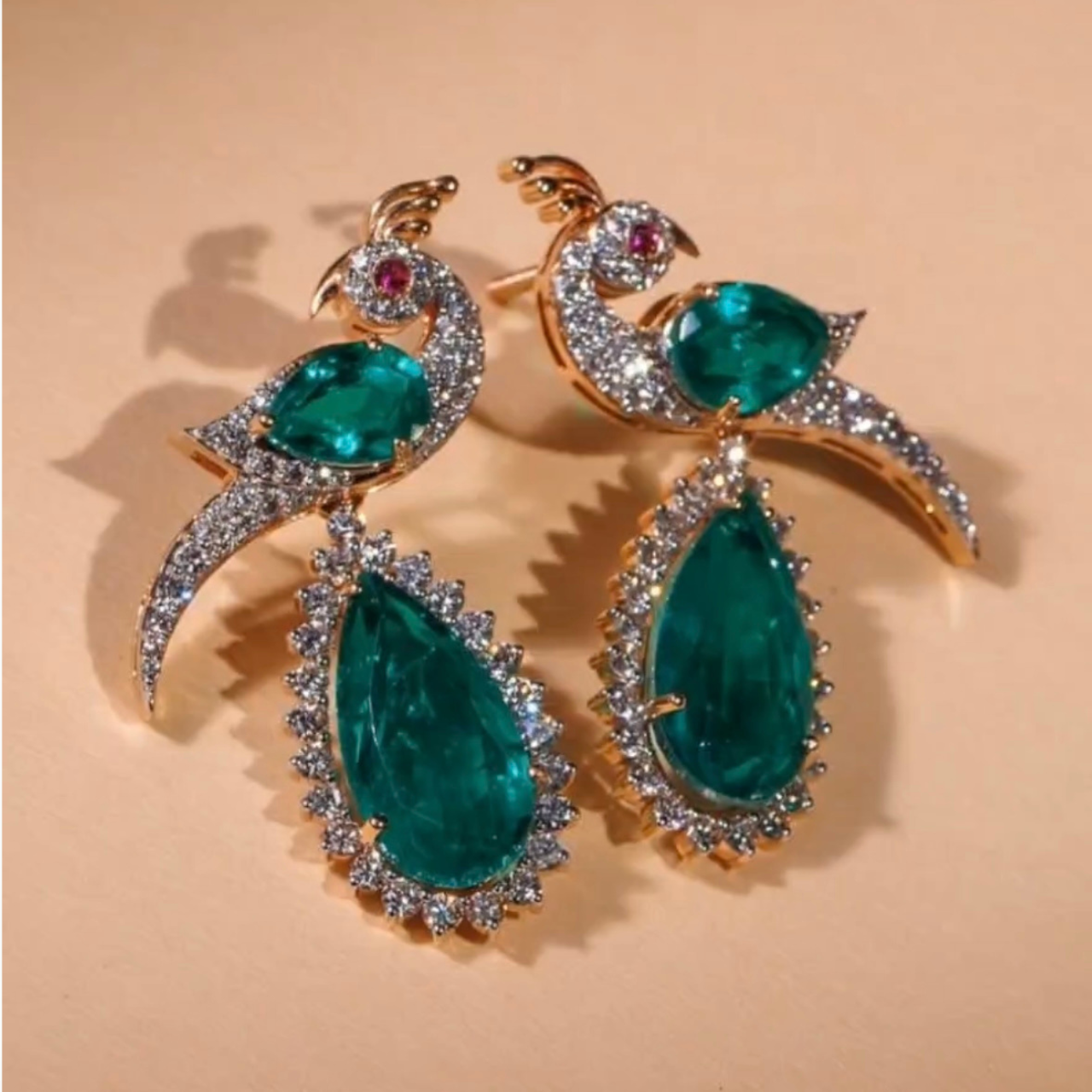 Luxury peacock design emerald green drop earrings with CZ diamonds in gold finish for women party and bridal wear
